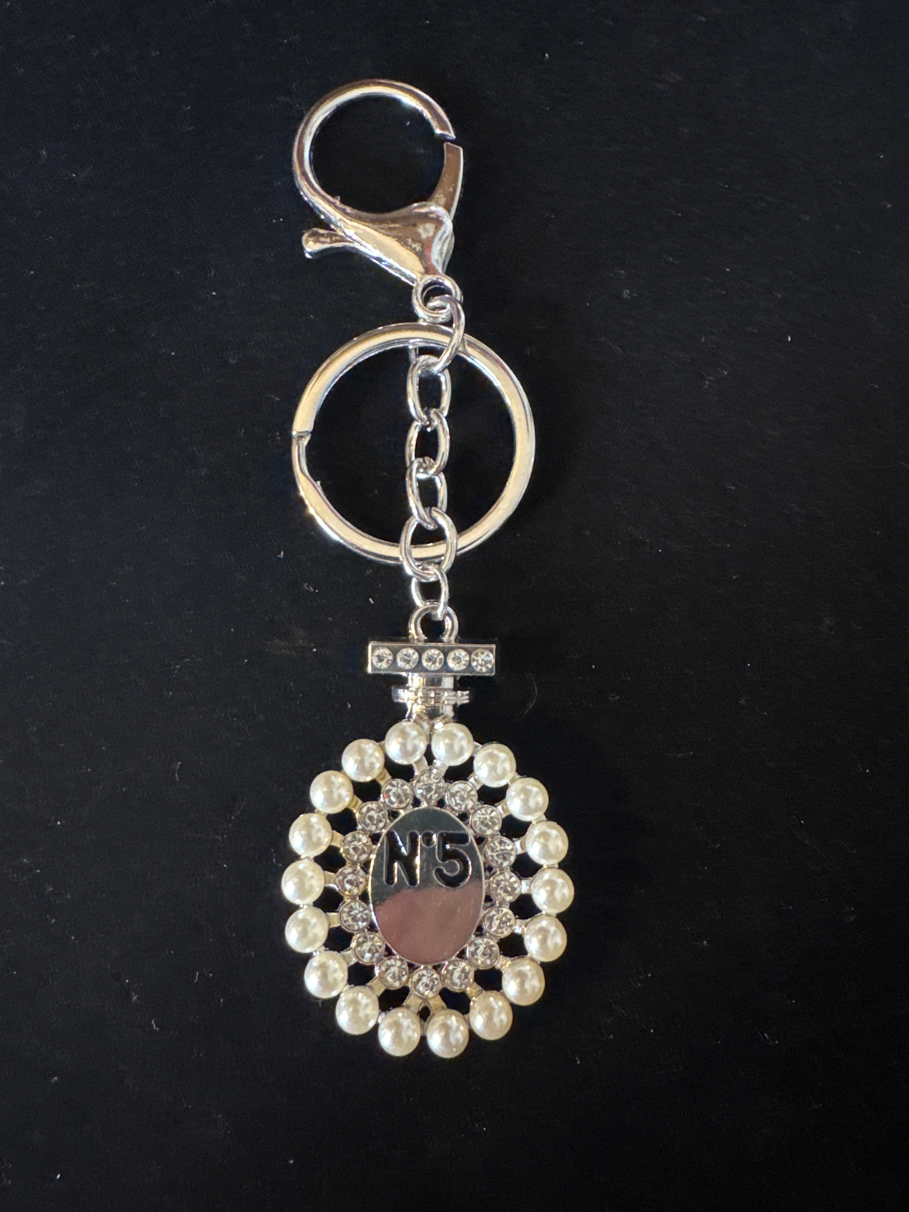 Key chain/bag charm perfume bottle N•5 with pearls and rhinestones-NEW. Comes in silver or gold.